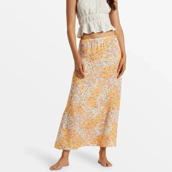 front view of the midi moment printed midi skirt. shows the mid rise. also shows the elastic waist, the aline fit and the floral design. 