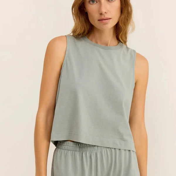 front view of the model wearing the sloane jersey muscle tank. shows the crew neckline. also shows the relaxed fit and the slight cropped length. 