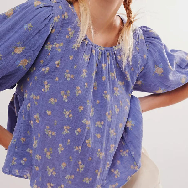 front view of the chloe printed top. shows the scoop neckline. also shows the puff sleeve and the cute floral print. 