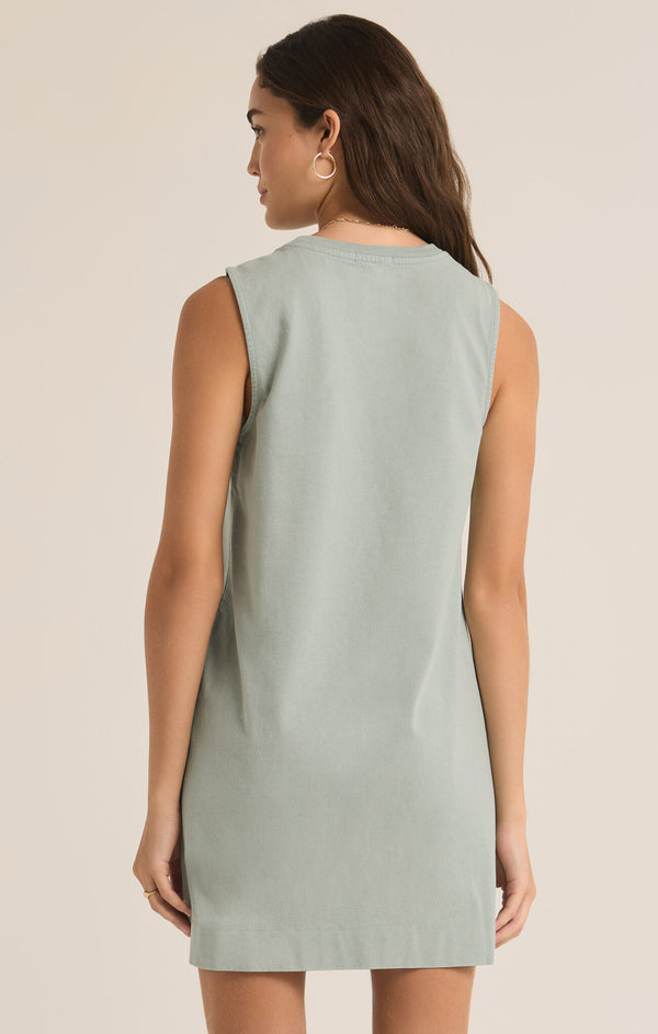 back view of the model wearing the sloane dress. shows that the dress is sleeveless. also shows the crew neckline and the regular fit. 