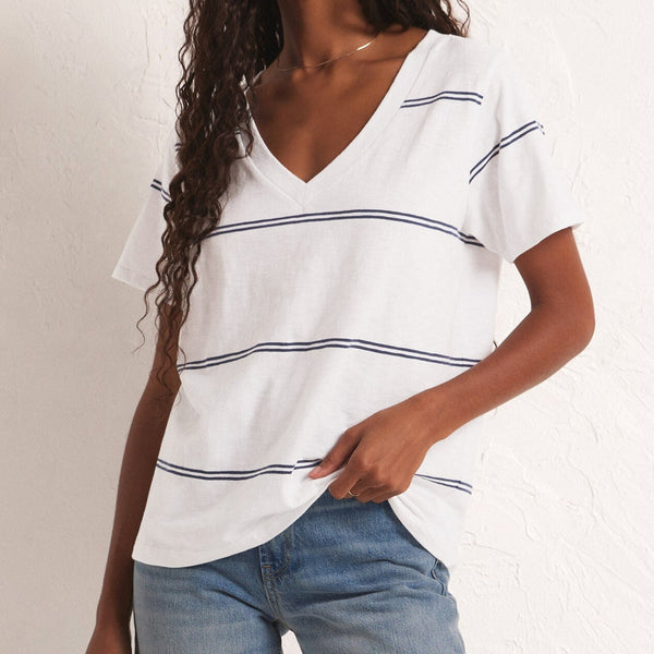 front view of the model wearing the girlfriemd twin stripe v neck. shows the over sized fit. also shows the v neck, and the two stripe design. 