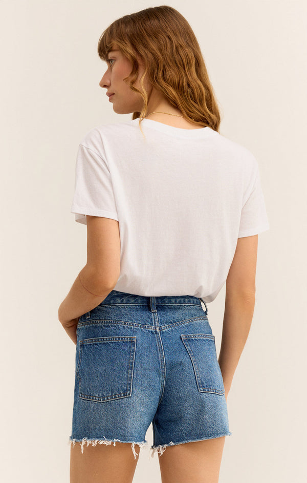 back view of the model wearing the go to tee. shows the crew neckline. also shows the short sleeves, the relaxed and cropped fit. 