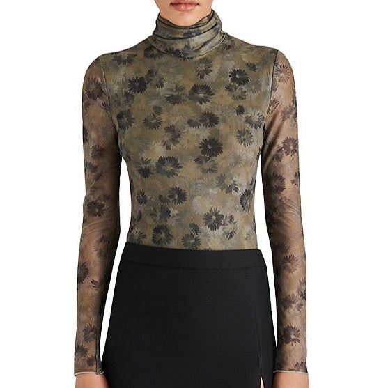 front view of model in mesh top. show the turtleneck, long sheer sleeves, fitted silhouette and floral print.