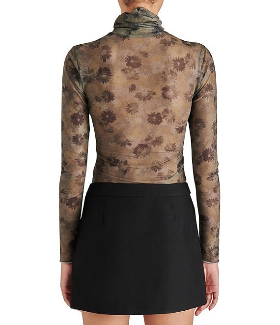 back view of model in shirt. shows sheer back, turtleneck, fitted silhouette and sheer sleeves.