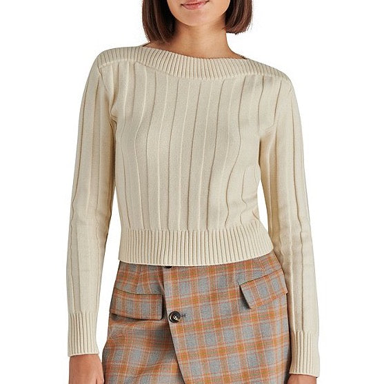 front view of model in sweater. shows the cropped length, boat neckline and ribbed fabrication.