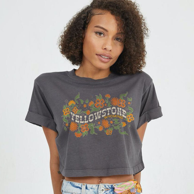 Front view of model wearing cropped boyfriend tee. Shows The cropped fit. Also shows the cuff sleeves, the crew neck and vintage wash. 