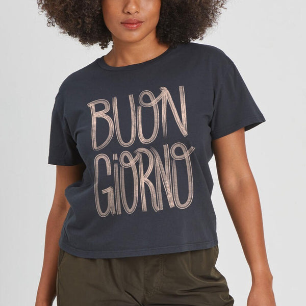 front view of the model wearing the buon giorno tee. shows the crew neckline. also shows the waist length, short sleeves and the front wording "BUON GIORNO"