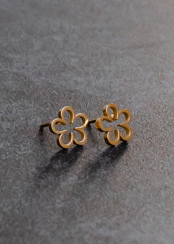 view of the flower studs. shows the shape of the flower, it is open in the middle and shows that they are gold. 