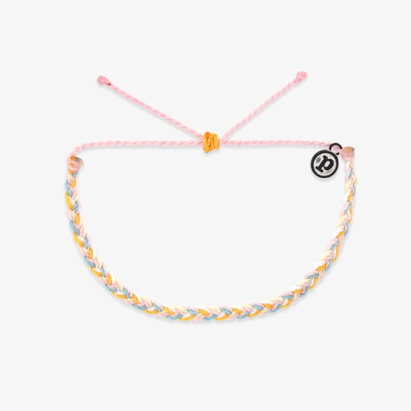 Braided bracelet with a pink string on a white background