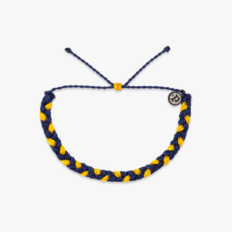 Navy and yellow braided bracelet on a white background
