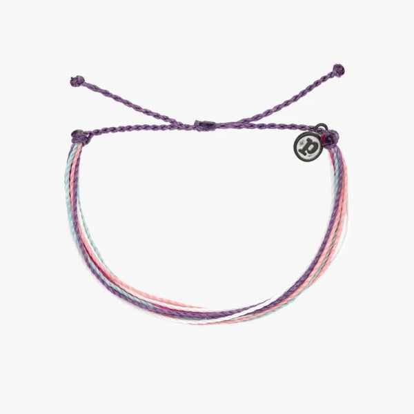 front view of the daybreak bracelet. shows the pull closure. also shows the multi colors including, purple, pink, light pink and blue. 