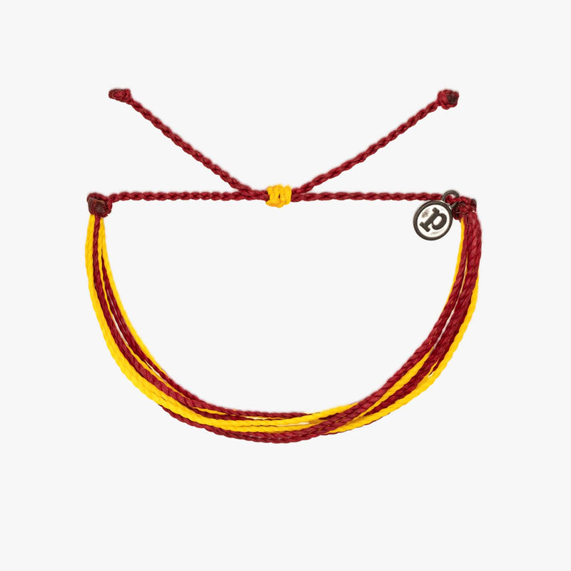 Bracelet with red and yellow cords on a white background