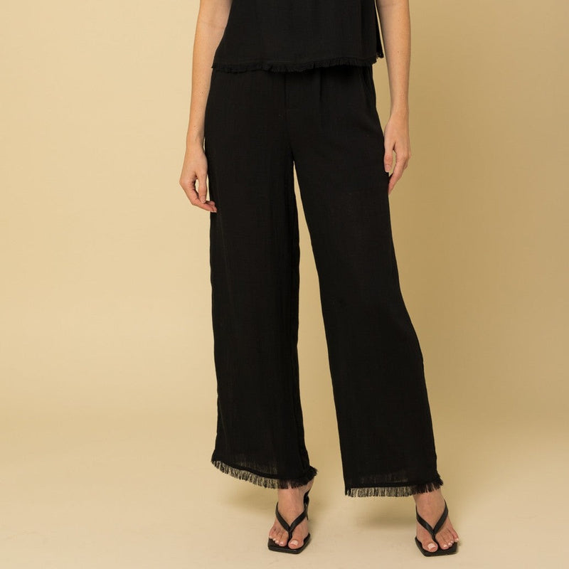 Front view of pants. Shows the straight leg and fringe hem..