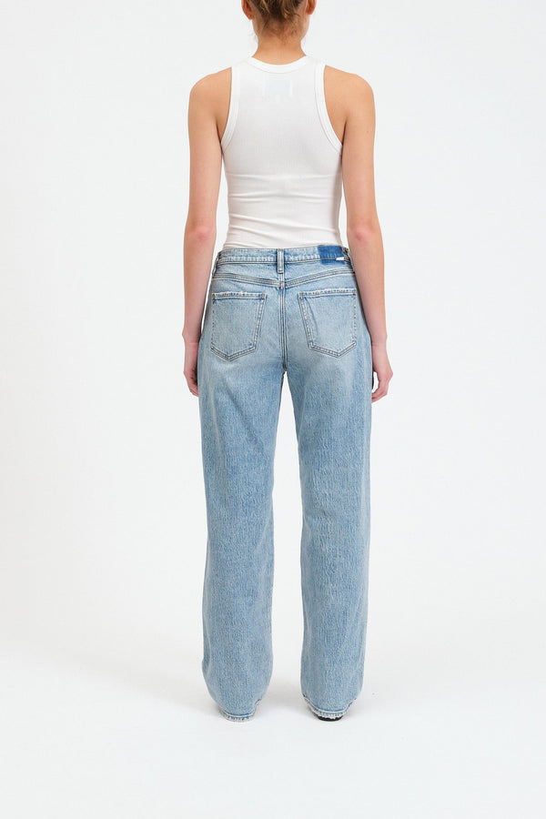 back view of the model wearing the 1999 slouch jeans, shows the back pockets. also shows the loose fitting legs, the loose fitting waist as well. 