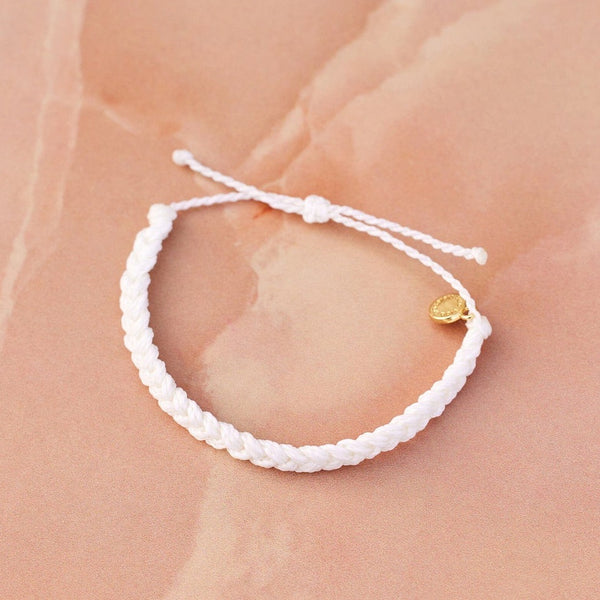 Front view of braided bracelet. Shows the gold plated P charm. Also shows the pull closure and the braided detail. 