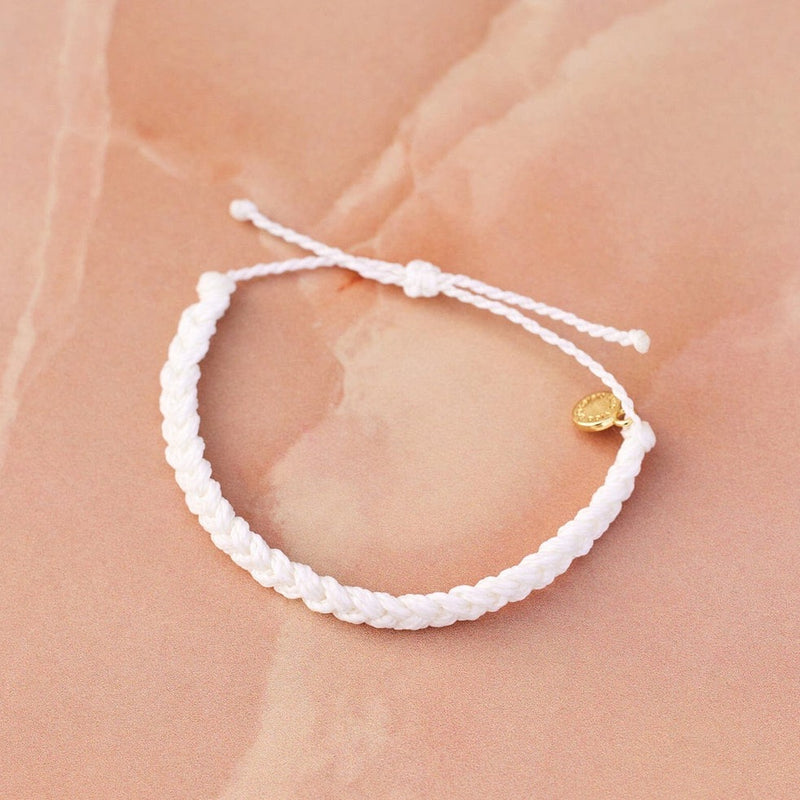 Front view of braided bracelet. Shows the gold plated P charm. Also shows the pull closure and the braided detail. 