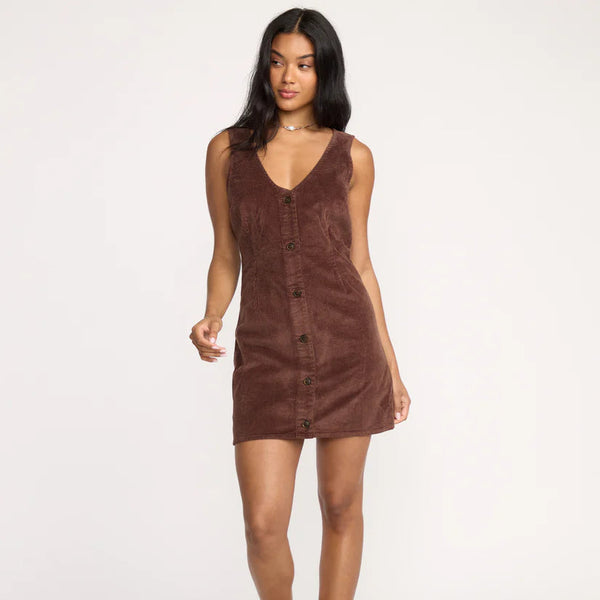 Woman wearing a brown dress on a white background