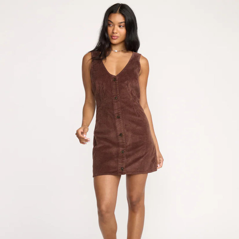 Woman wearing a brown dress on a white background