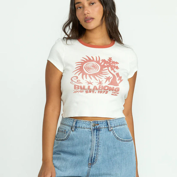 front view of the model wearing the electric feeling top. shows the crew neckline. also shows the graphic design, the cropped/snug fit and the red trim around the neckline. 
