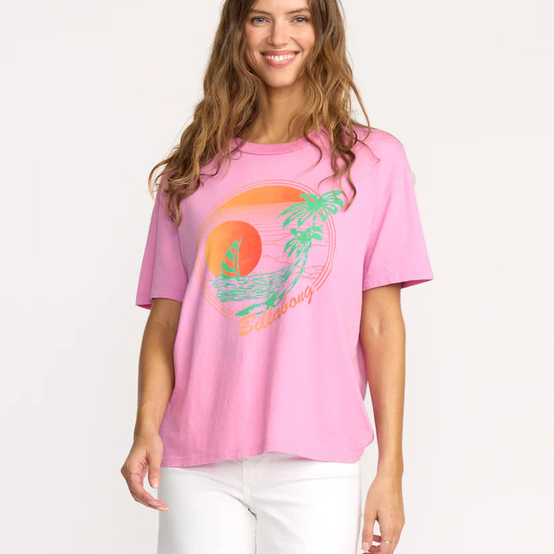 front view of the model wearing the bright new day tee. shows the crew neckline. also shows the front screen print, the relaxed fit and the pink color. 