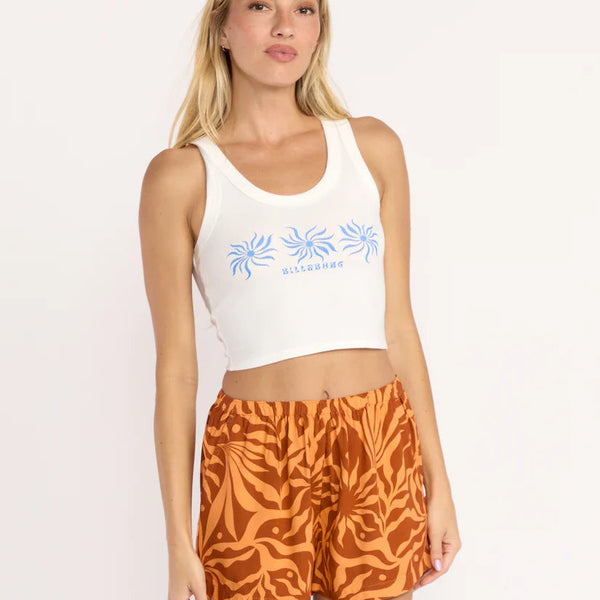 front view of the model wearing the miles away tank. shows the scoop neckline. also shows the screen print, the cropped length and the slightly wider straps. 