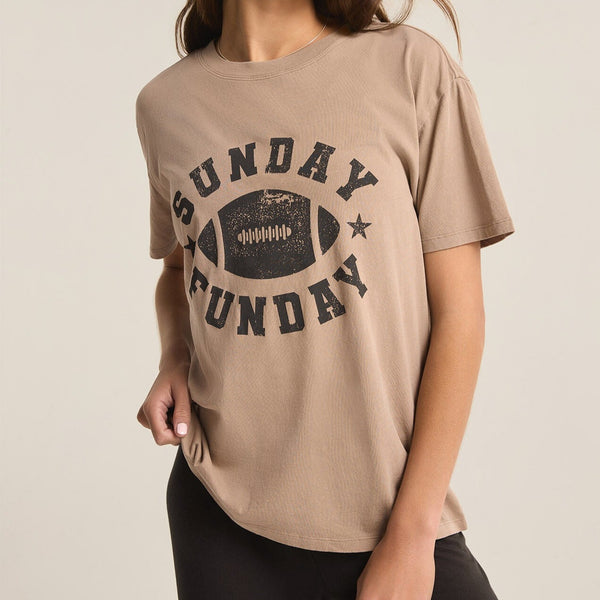front view of the model wearing the sunday funday boyfriend tee. shows the crew neckline. also shows the front graphic, the oversized fit and short sleeves. 
