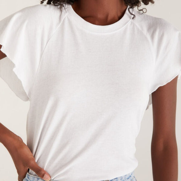 front view of the model wearing the abby flutter tee. shows the flutter sleeve detail. also shows the crew neckline and the raglan seams. 