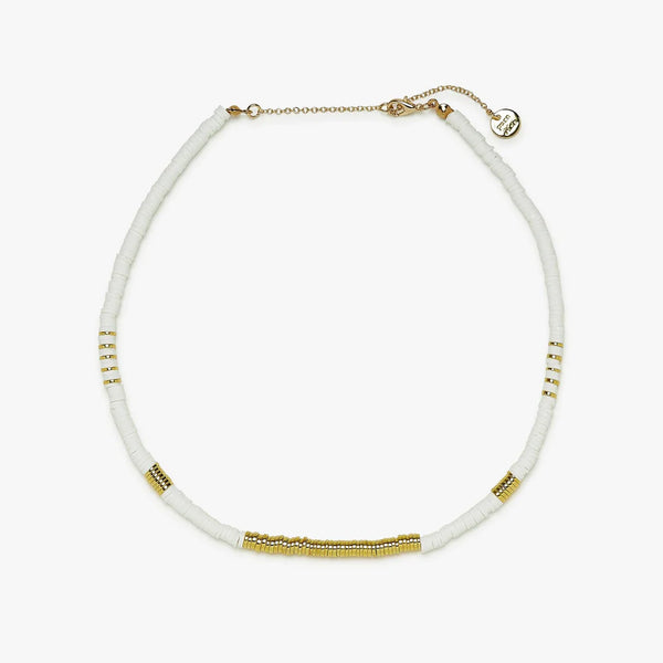 Shows choker with flat white and gold beads. Shows adjustable chain clasp. 