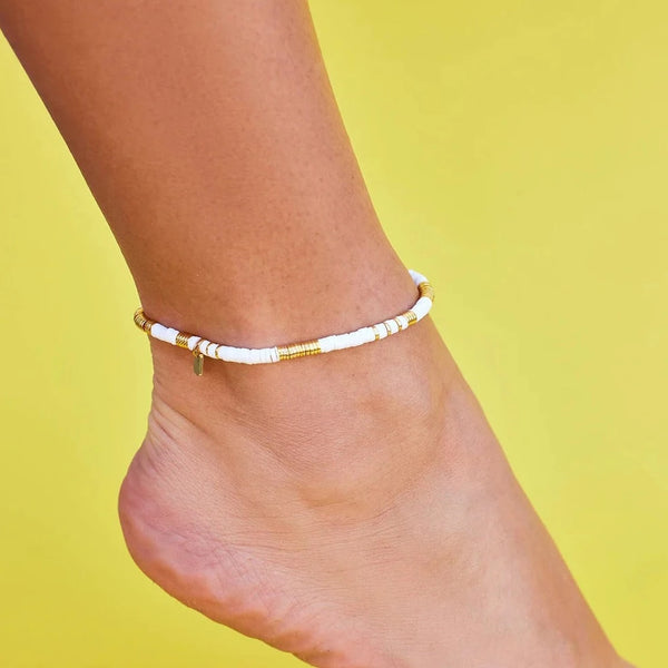 Shows ankle on anklet with flat beads.