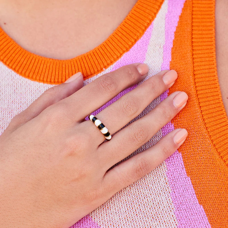 Another view of the model wearing the ring on her middle finger. 
