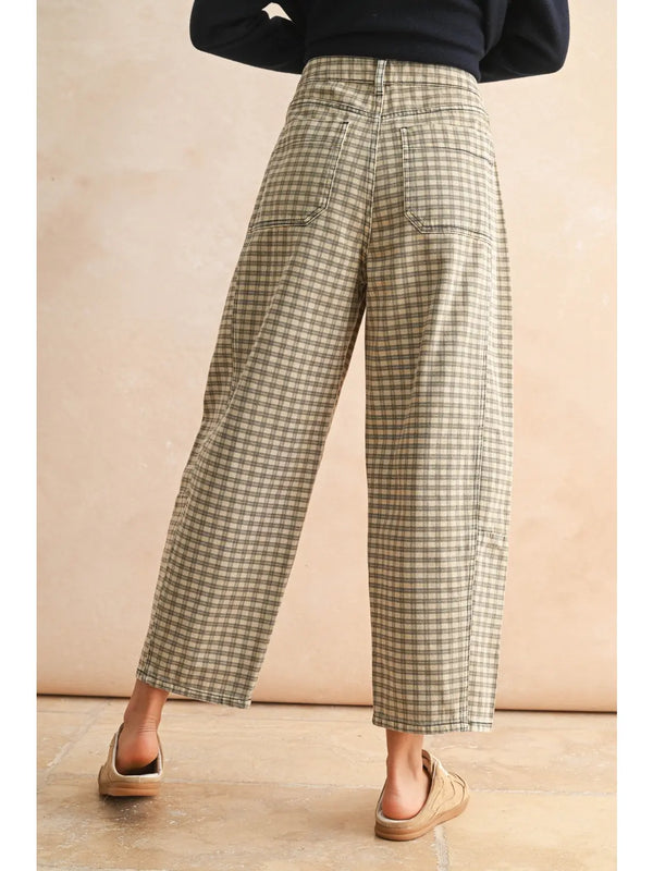 model wearing the gingham barrel pants with the back pockets on cream background