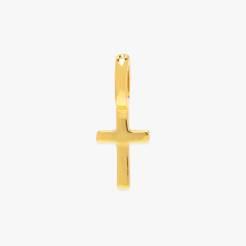 Gold cross pendant on a white background