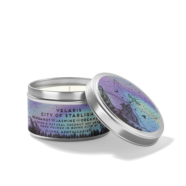 Candle in a tin with a colorful label on a white background