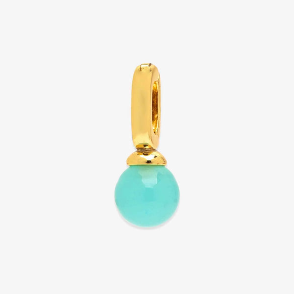 Gold pendant with a turquoise bead on a white background