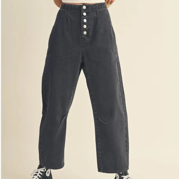 front view of the alix washed cotton pants. shows the barrel like style. also shows the button fly closure, the relaxed fit, the defined seaming throughout and the side pockets. 