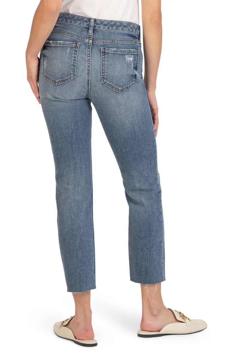 Back view of jeans. Shows high waist, back pockets, and raw hem.