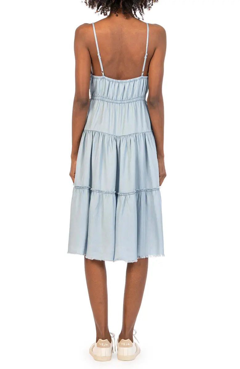 Back of dress. Shows adjustable spaghetti straps and tiered skirt.