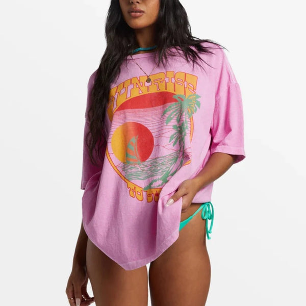 front view of the model wearing the sunrise to sunset oversized t-shirt. shows the crew neckline. also shows the oversized fit and the screen printed graphic. 