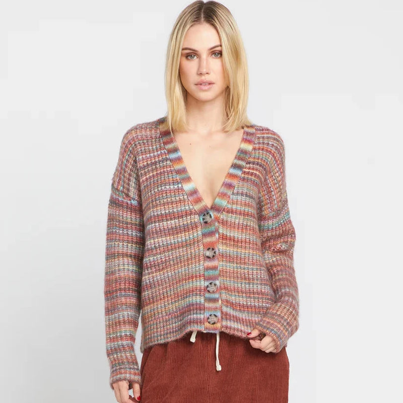 front view of the model wearing the desert dreamz cardi. shows the dropped shoulders. also shows the v neckline, the button down closure and the oversized fit. 