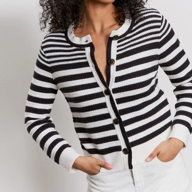 front view of the model wearing the city summer cardigan. shows the crew neckline. also shows the button down closure, the black and white stripes, and the ribbed detailing. 