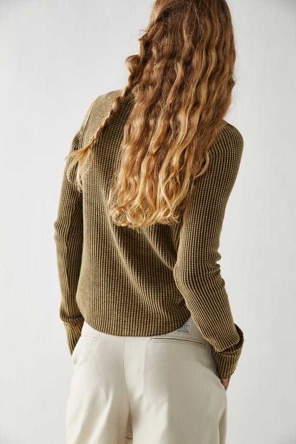 back view of model in shirt. shows semi fitted silhouette and long sleeves