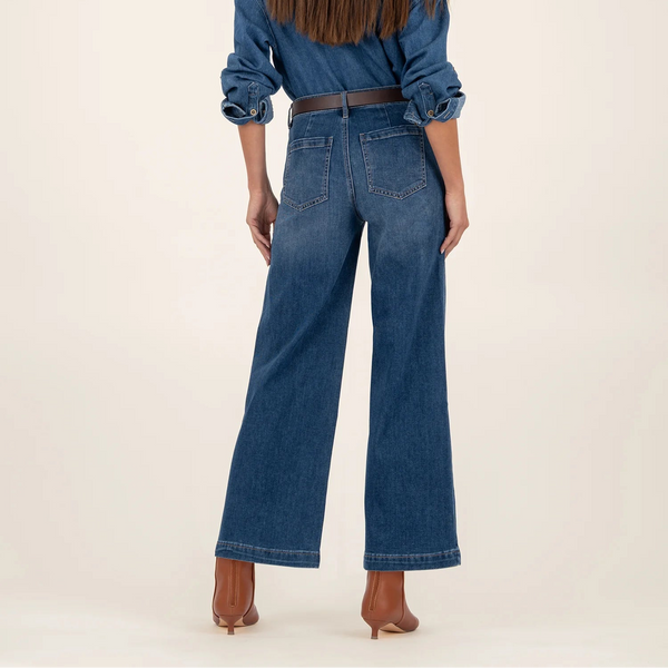 Person wearing a denim outfit with a white background