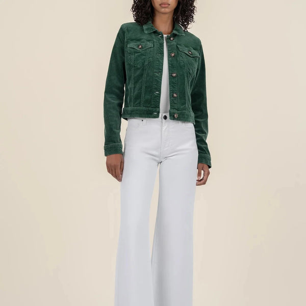 front view of the model wearing the julie corduroy crop jacket. shows the patch pockets. also shows the green color, the button down closure, the cropped length and the corduroy detail. 