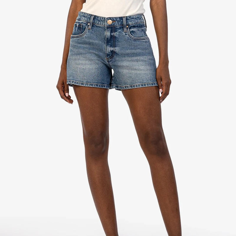 front view of model wearing the jane high rise short. shows the retro high rise. also the button/zipper closure, the midi length and the whisker detailing. 