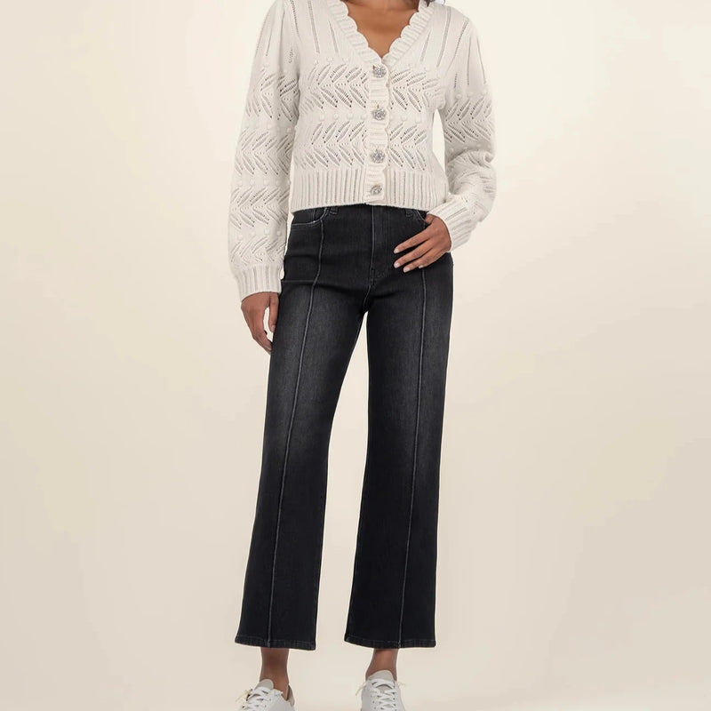 front view of the mimi scallop neck cardigan. shows the v neckline. also shows the scallop detailing, the crystal buttons, the cut details. 