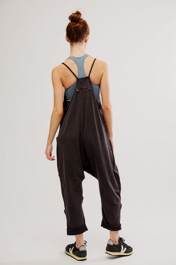 back view of the model wearing the hot shot onesie. shows the racer back. also shows the zipper detail and slouchy fit. 