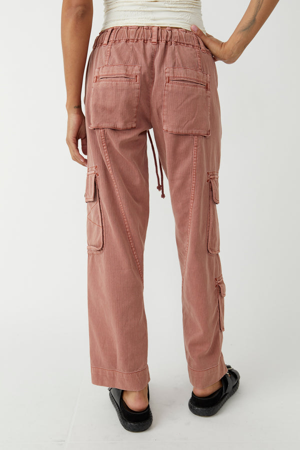 back view of the model wearing the tahiti cargo pant. shows the low rise. also shows the slouchy fit, the two back pockets and the ankle length. 