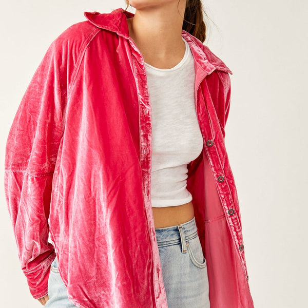 Front view of model wearing top. Shows the button closure. Also shows the collared neckline, the drop shoulders and this beautiful bright pink color.  