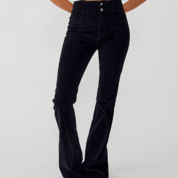Black courdoroy flare pants- close up of front leg showcases pintucked front pandel, two button zip fly and flare leg