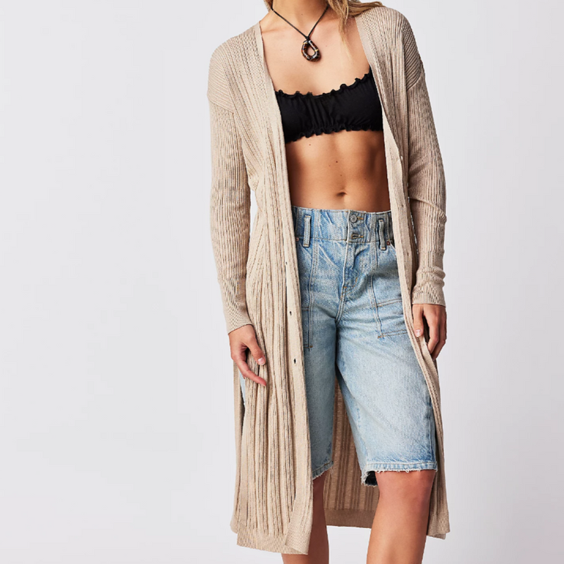 longline open front cardigan worn by model unbuttoned, falls below knee styled with long shorts and a bralette